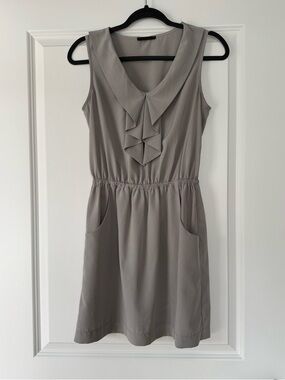 Xtaren Sleeveless Ruffle-Front Mini Dress in Taupe